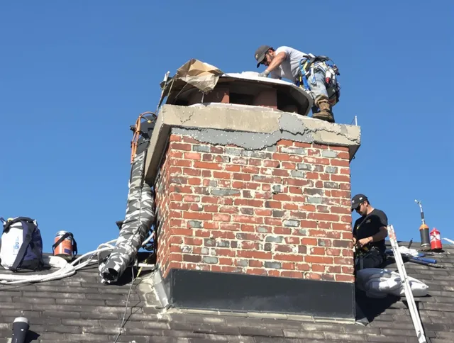 Colchester Chimney Sweep installing a custom chimney crown in Colchester, CT