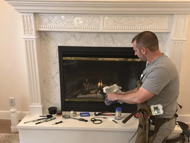Colchester Chimney Sweep performing fireplace maintenance in Colchester, CT